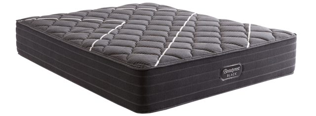 A Beautyrest® Black mattress with light rays radiating from behind it.